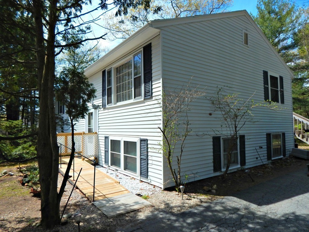 174 Ayer Road Shirley, MA 01464 - Photo 27 of 30 a view of house with a tree in the background