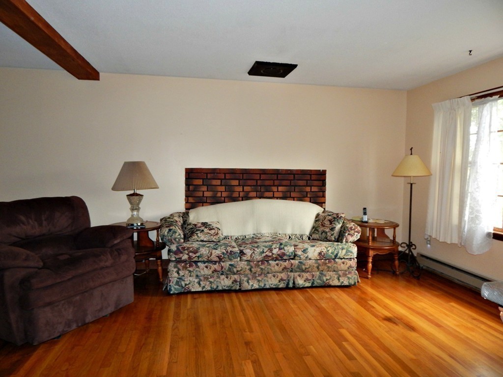 174 Ayer Road Shirley, MA 01464 - Photo 3 of 30 a living room with a bed furniture and a window
