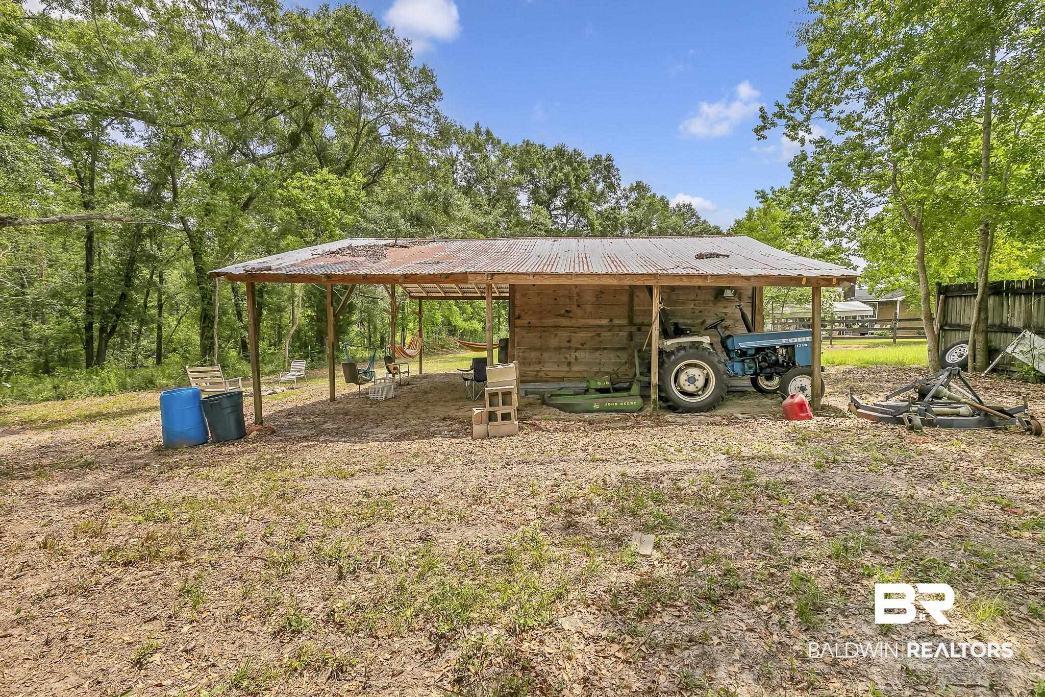 18626-1 Moore Road Andalusia, AL 36420 - Photo 10 of 17 View of yard featuring a detached carport, an outdoor structure, and a pole building