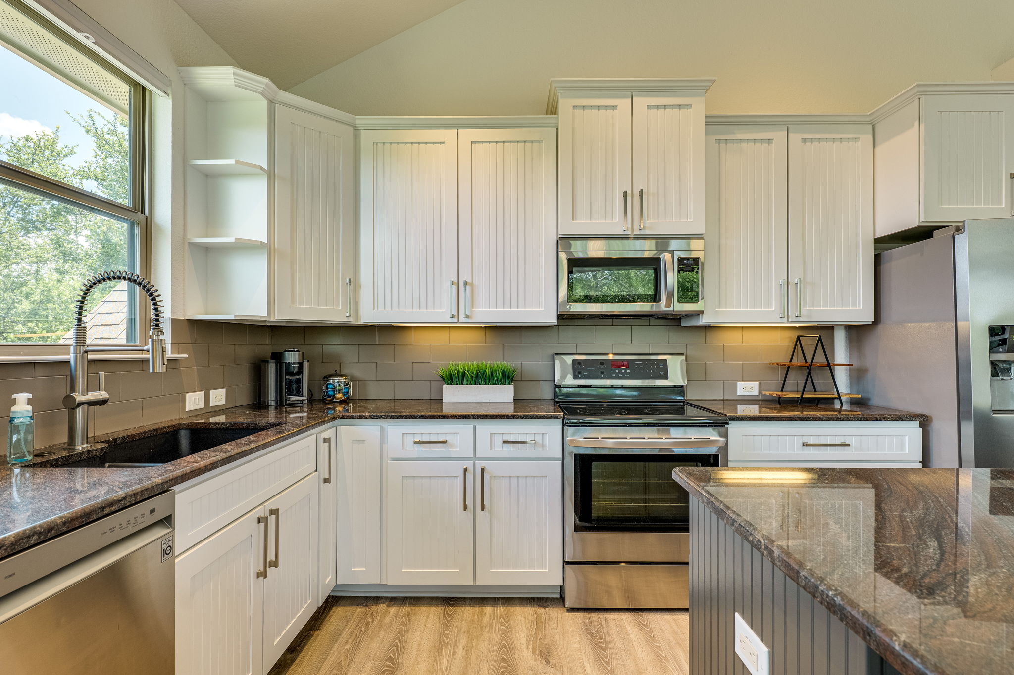 433 Venture Boulevard South Point Venture, TX 78645 - Photo 13 of 36 There's plenty of space for cooking while staying connected to all the action.