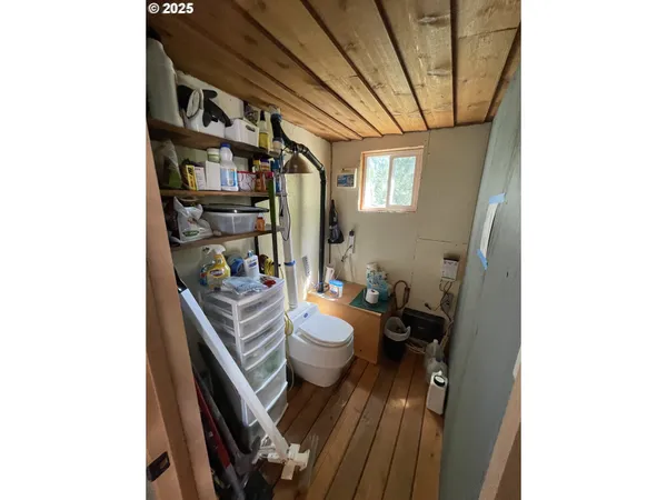 a living room with furniture and a book shelf