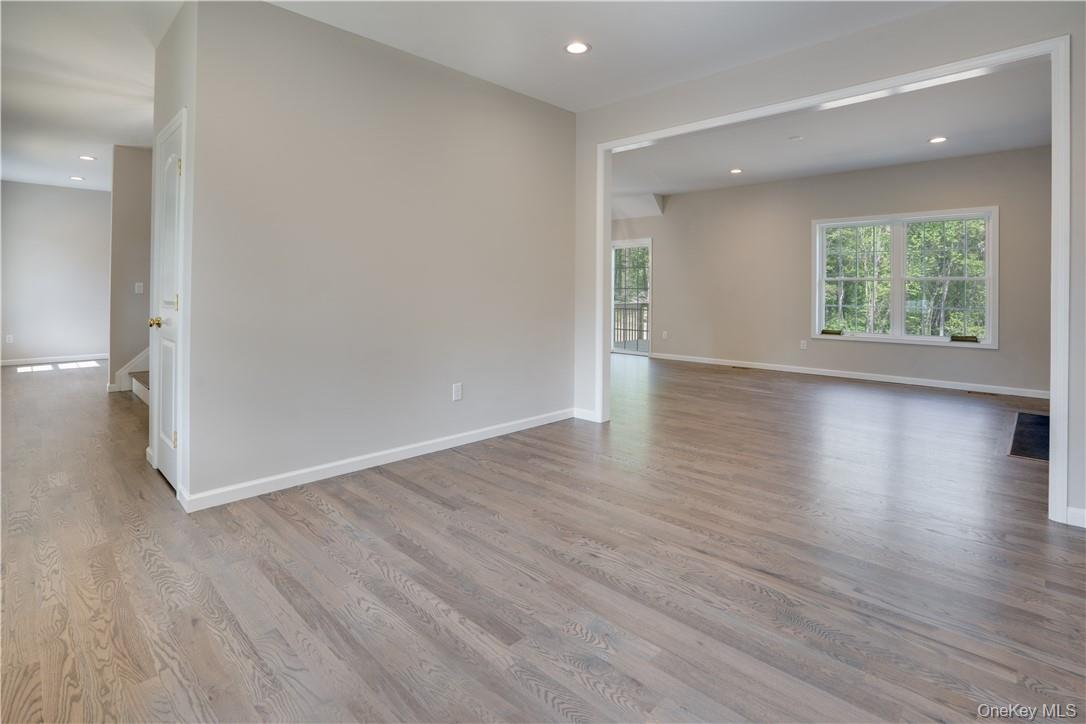 991 Freedom Road Pleasant Valley, NY 12569 - Photo 10 of 23 an empty room with wooden floor and windows