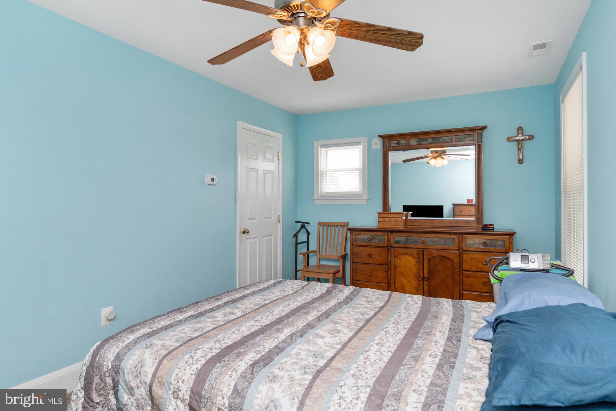 4305 Fullerton Avenue Baltimore, MD 21206 - Photo 17 of 36 a bedroom with a bed and a chandelier