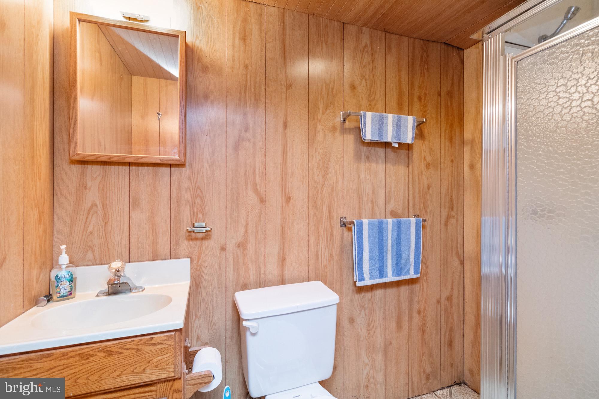 4305 Fullerton Avenue Baltimore, MD 21206 - Photo 25 of 36 a bathroom with a sink and a mirror