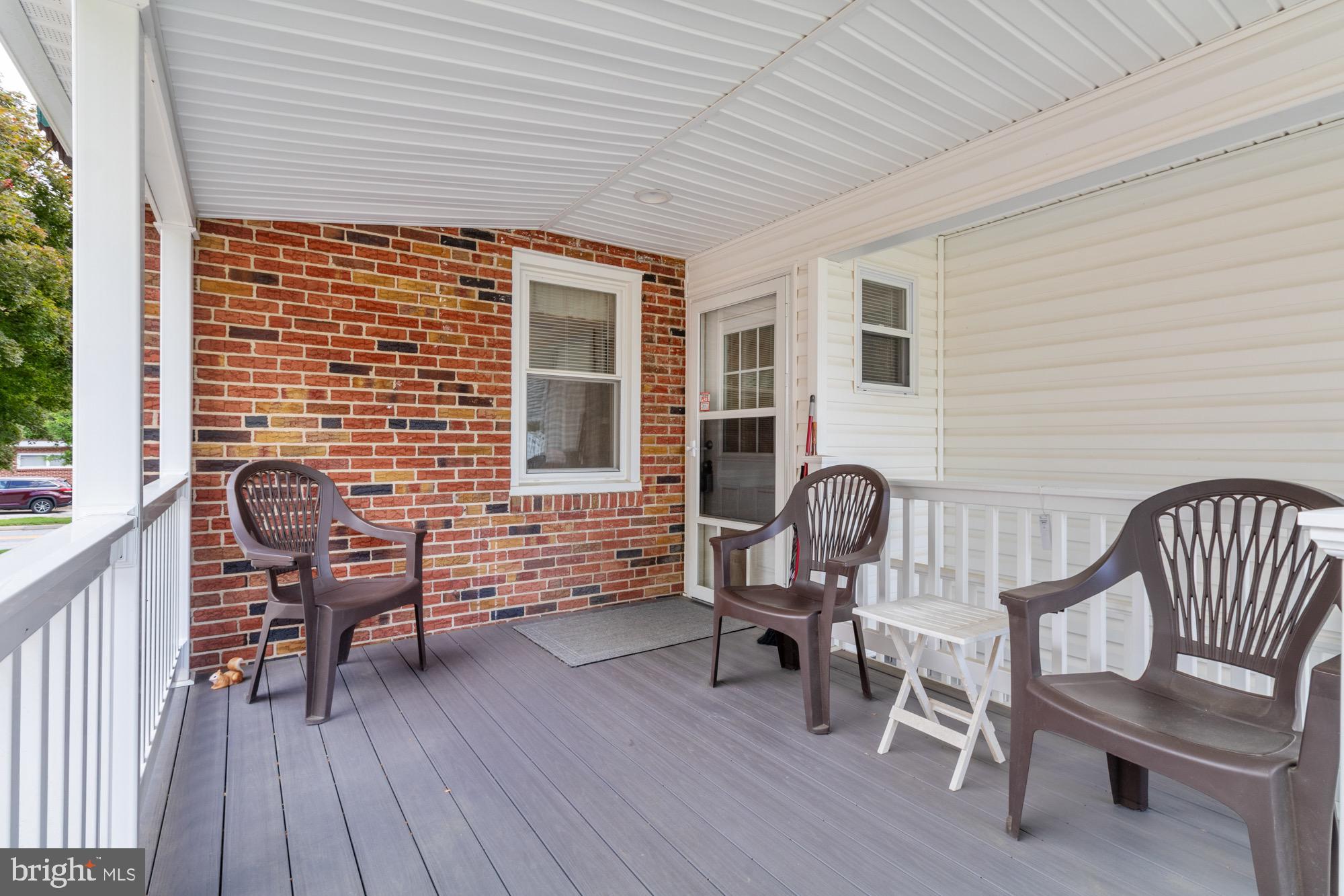 4305 Fullerton Avenue Baltimore, MD 21206 - Photo 29 of 36 a porch with seating space and wooden floor