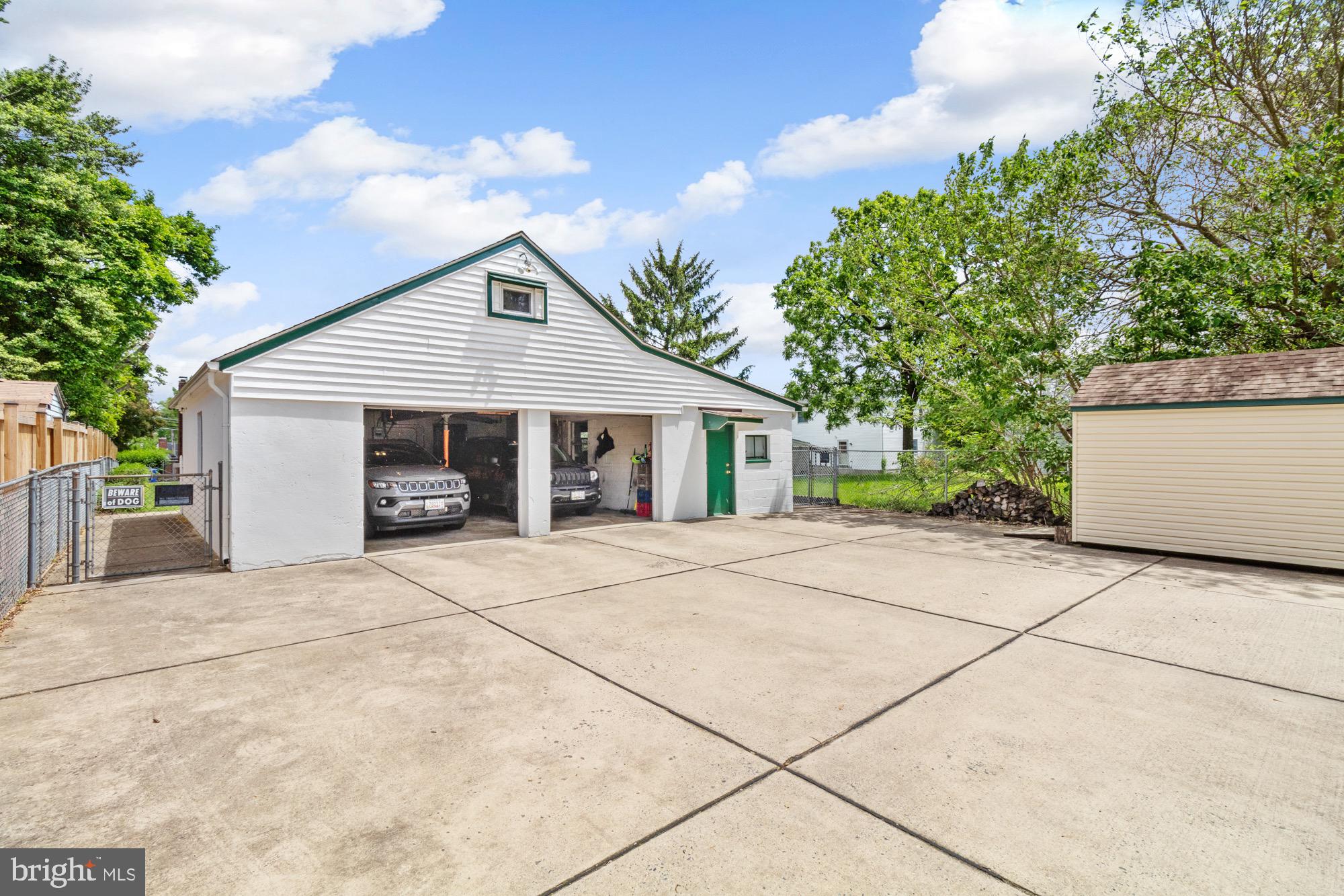 4305 Fullerton Avenue Baltimore, MD 21206 - Photo 35 of 36 a front view of house with yard and trees in the background