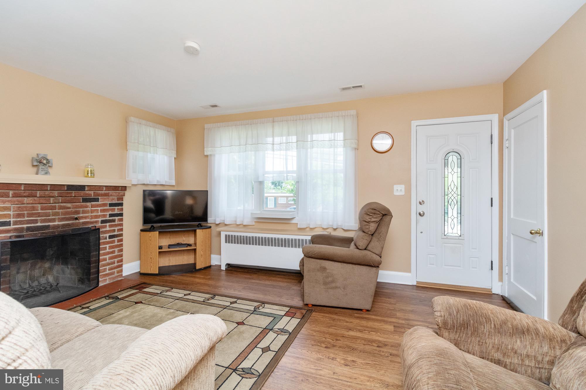 4305 Fullerton Avenue Baltimore, MD 21206 - Photo 6 of 36 a living room with furniture and a fireplace