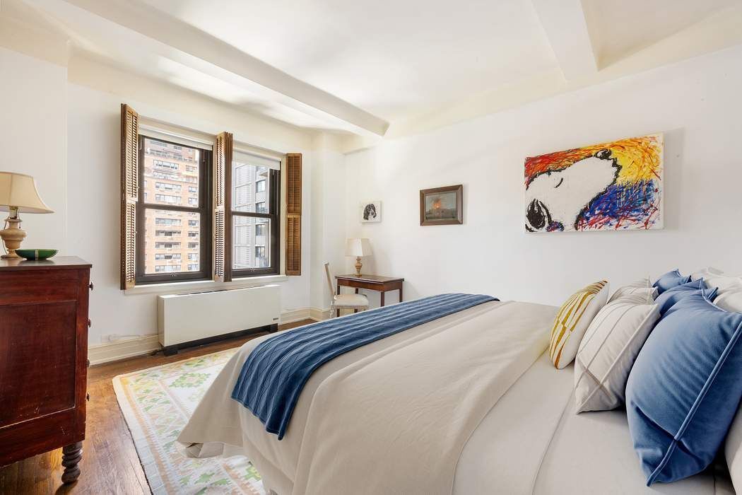 215 East 72nd Street, Unit 9W Manhattan, NY 10021 - Photo 6 of 15 a bedroom with a bed and a window