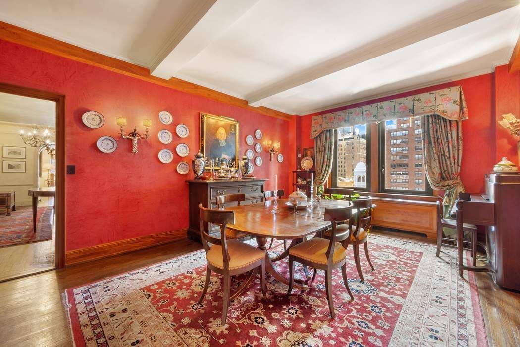 215 East 72nd Street, Unit 9W Manhattan, NY 10021 - Photo 8 of 15 a dining room with furniture and a floor to ceiling window