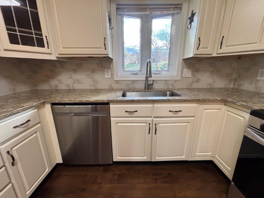 136 Grimes Street Roanoke, VA 24019 - Photo 15 of 101 a kitchen with granite countertop white cabinets and a sink