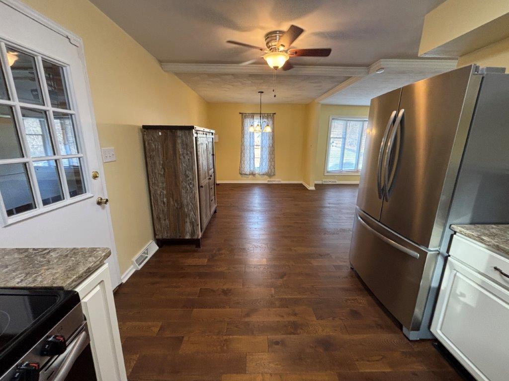 136 Grimes Street Roanoke, VA 24019 - Photo 18 of 101 a view of a refrigerator in kitchen and wooden floor