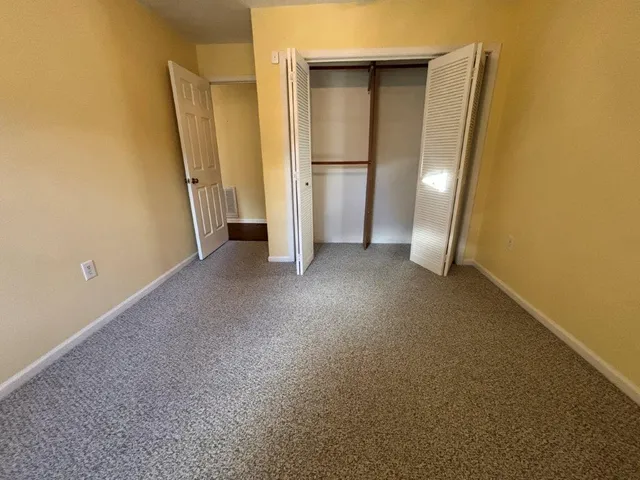 a view of a room with wooden walls