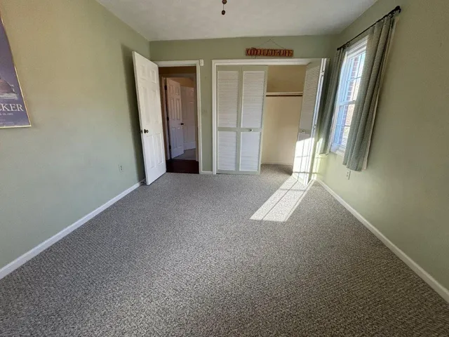 a bathroom with a toilet and a bathtub