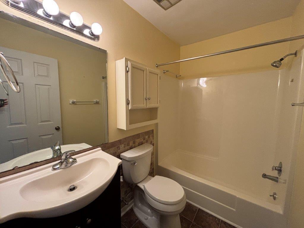 136 Grimes Street Roanoke, VA 24019 - Photo 31 of 101 a bathroom with a sink toilet and shower