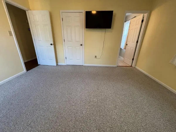 a view of fireplace and wooden floor