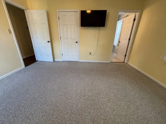 a view of fireplace and wooden floor