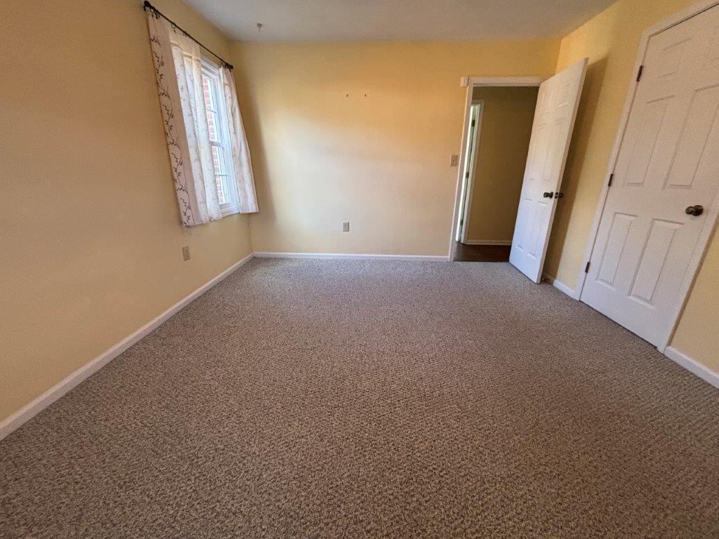 136 Grimes Street Roanoke, VA 24019 - Photo 36 of 101 a view of a room with wooden floor and windows