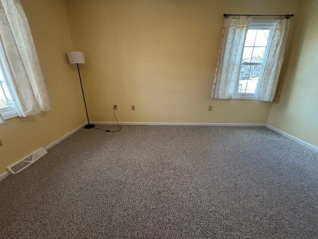 a living room with furniture and a projector