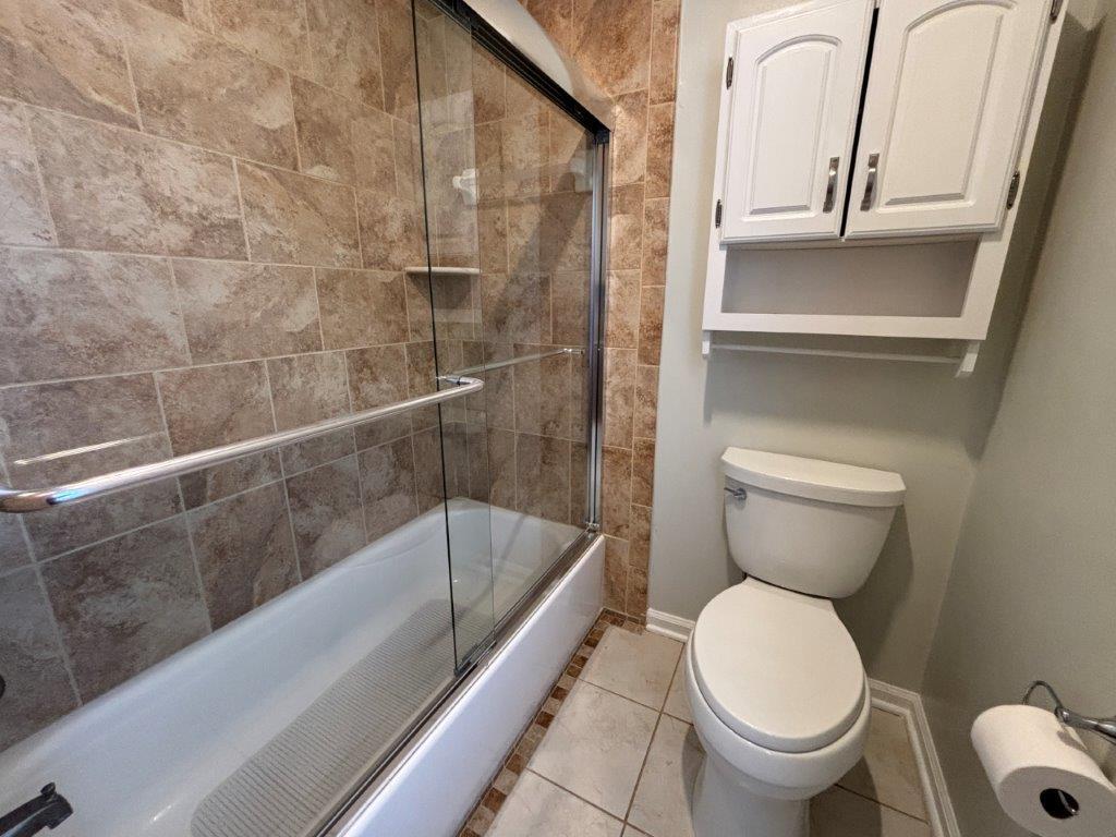 136 Grimes Street Roanoke, VA 24019 - Photo 42 of 101 a bathroom with a toilet and a shower