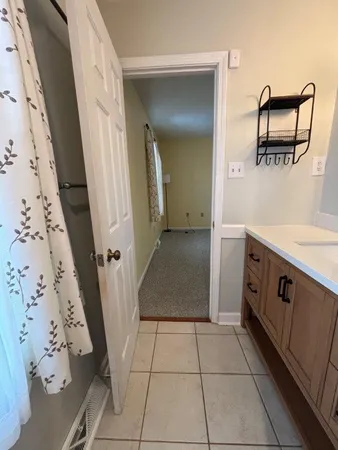 a stove top oven sitting inside of a kitchen