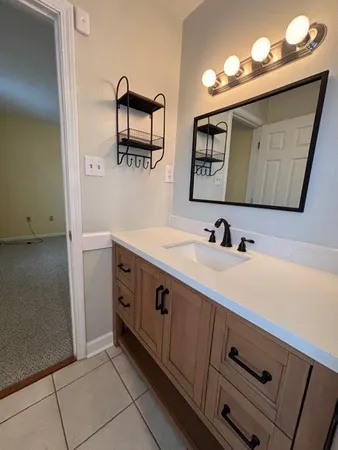 a view of cabinets with wooden floor and a window