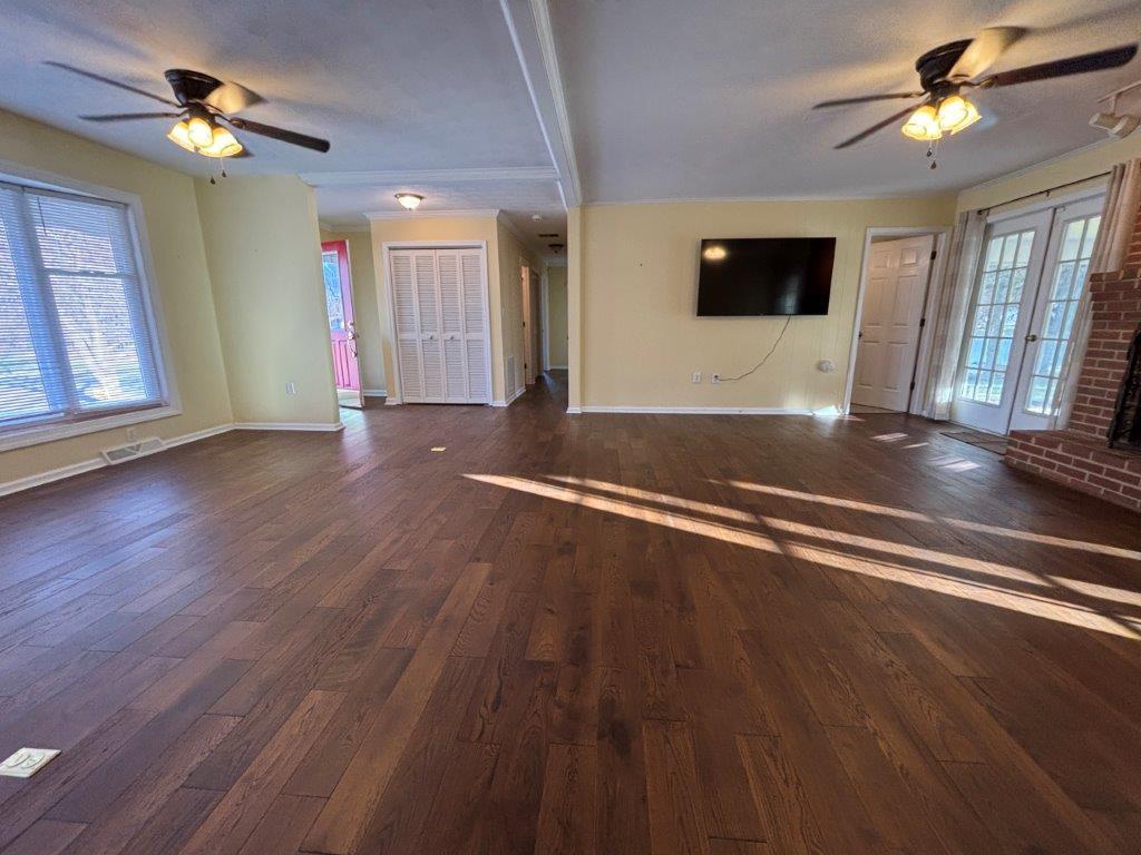 136 Grimes Street Roanoke, VA 24019 - Photo 6 of 101 a view of a livingroom with wooden floor and a ceiling fan