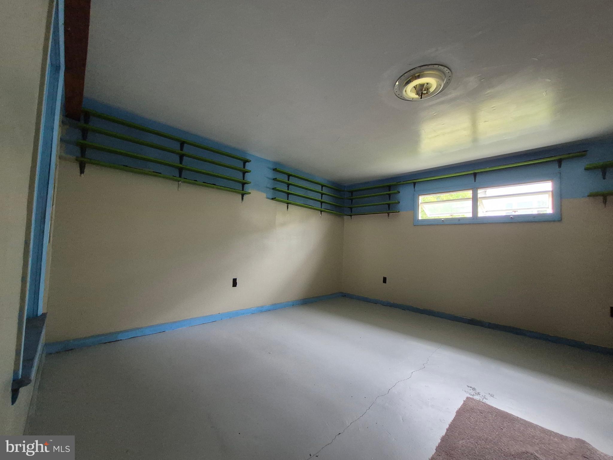 715 Main Street Sharptown, MD 21861 - Photo 11 of 36 a view of an empty room with a window