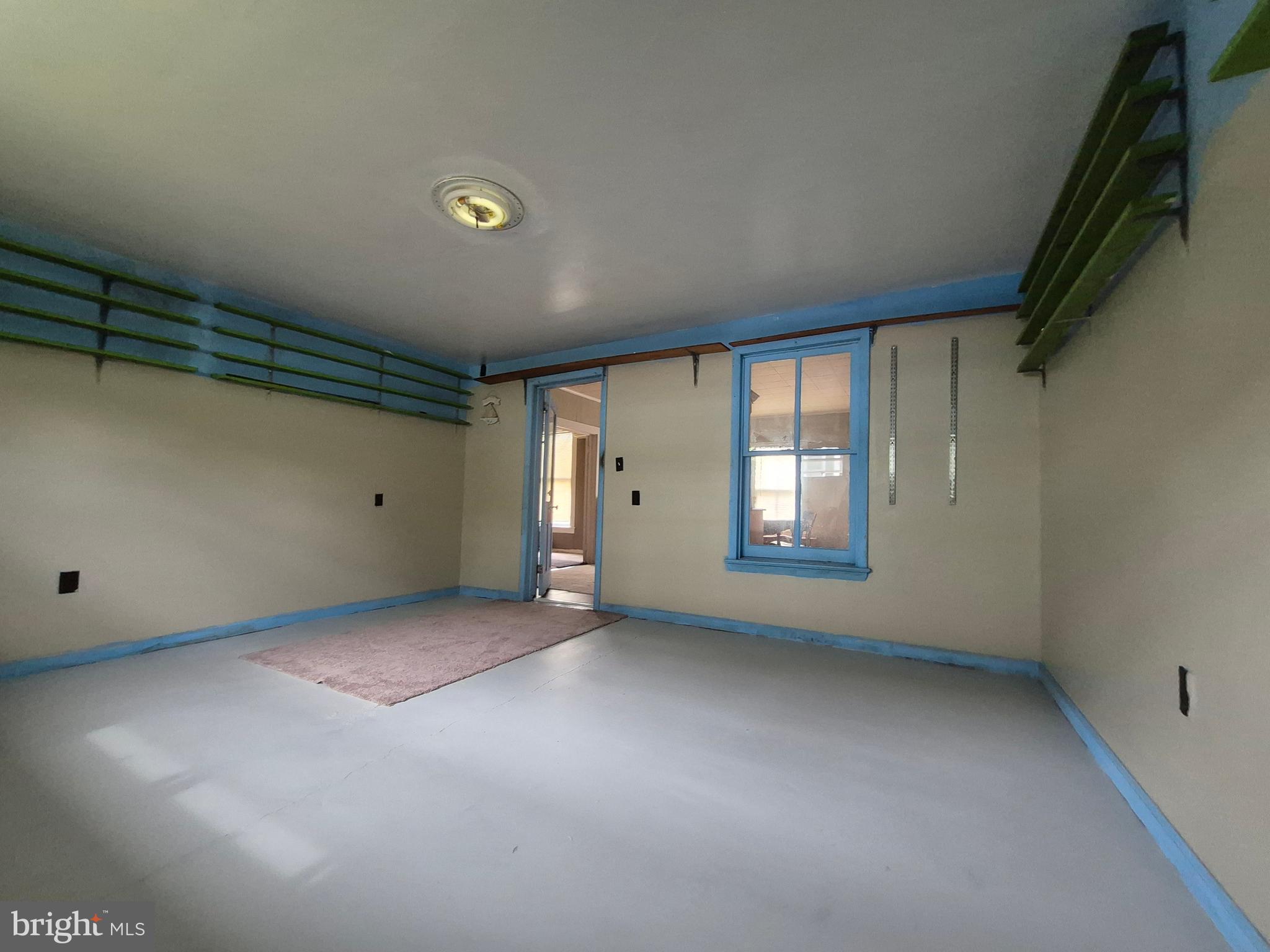 715 Main Street Sharptown, MD 21861 - Photo 13 of 36 a view of an empty room with a window