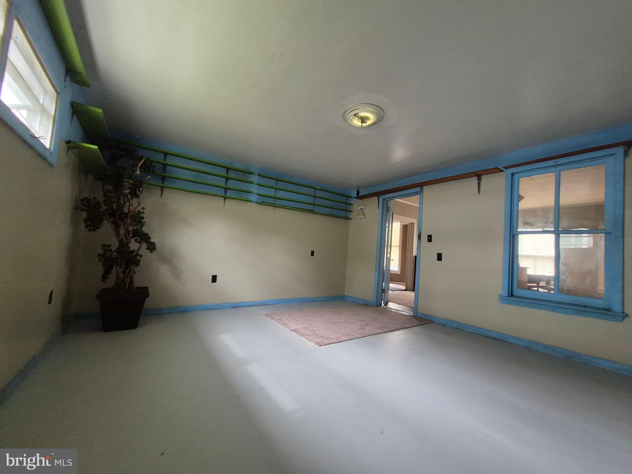 715 Main Street Sharptown, MD 21861 - Photo 14 of 36 an empty room with windows