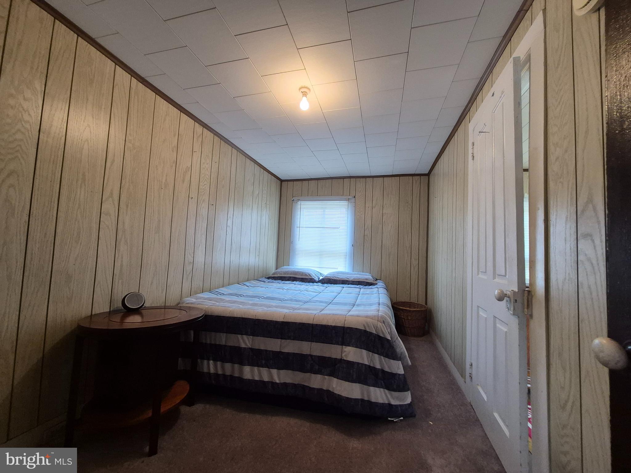 715 Main Street Sharptown, MD 21861 - Photo 17 of 36 a bedroom with a bed and a window