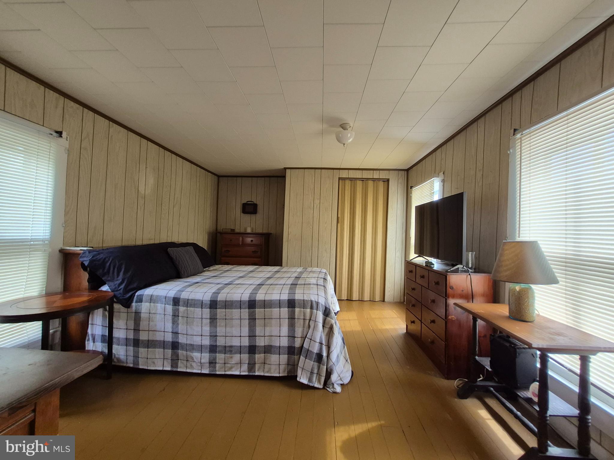 715 Main Street Sharptown, MD 21861 - Photo 19 of 36 a bedroom with a bed and a couch