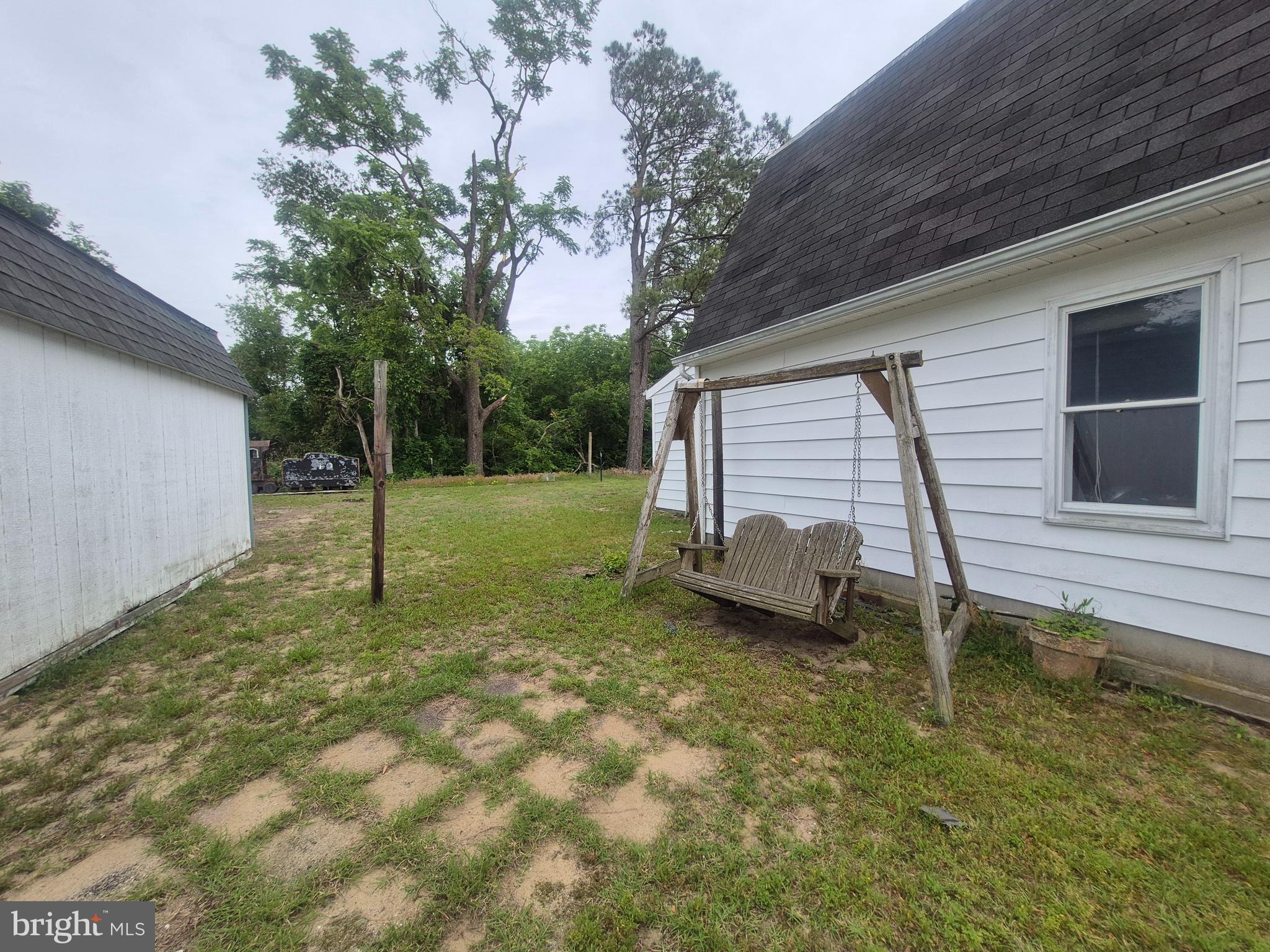 715 Main Street Sharptown, MD 21861 - Photo 35 of 36 a backyard of a house with lots of green space