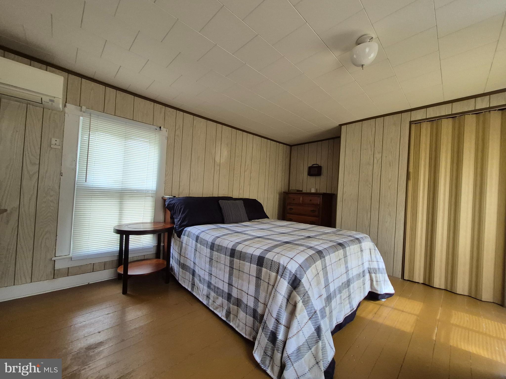 715 Main Street Sharptown, MD 21861 - Photo 36 of 36 a bedroom with a bed table and a window