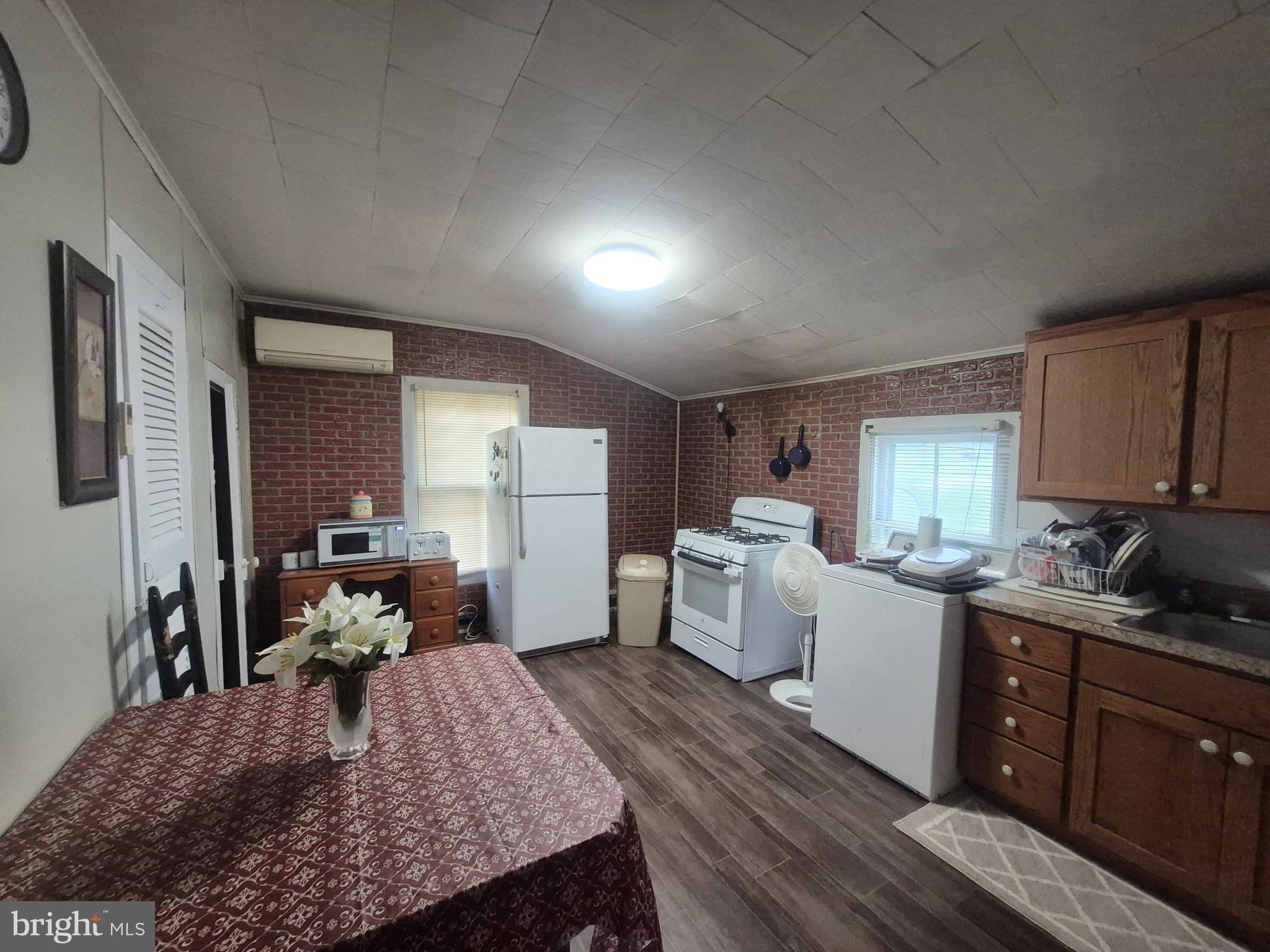715 Main Street Sharptown, MD 21861 - Photo 7 of 36 a kitchen view with a stove and a refrigerator