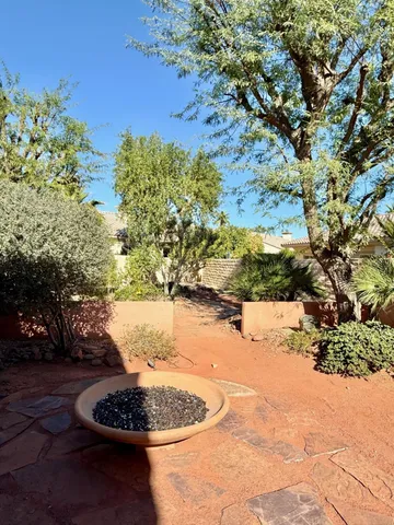 a bedroom with furniture and large windows