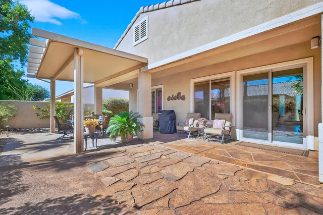 a view of an entryway with a flower pot and a fireplace