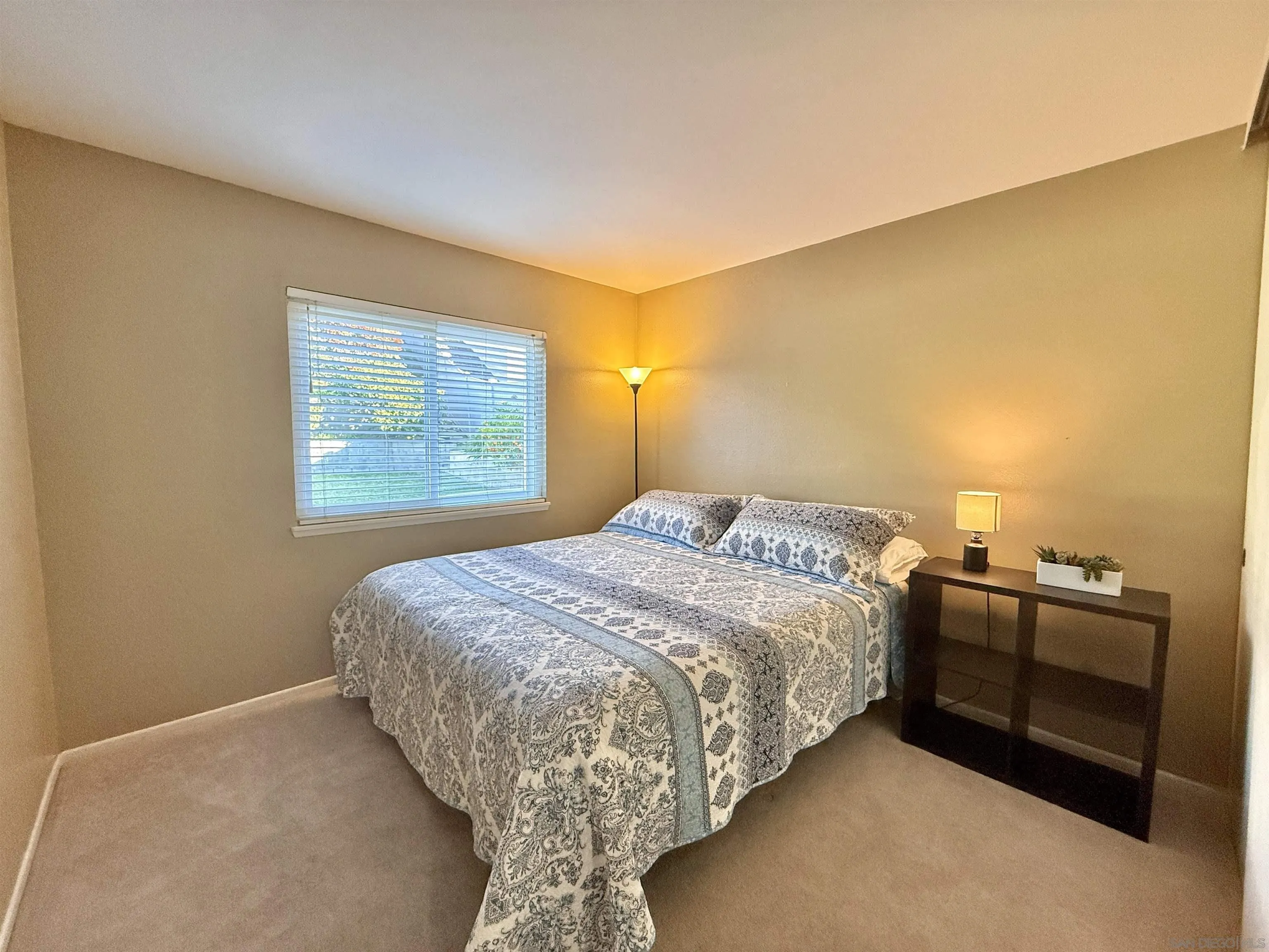 2049 Wind River Road El Cajon, CA 92019 - Photo 12 of 29 a bedroom with a bed and dresser