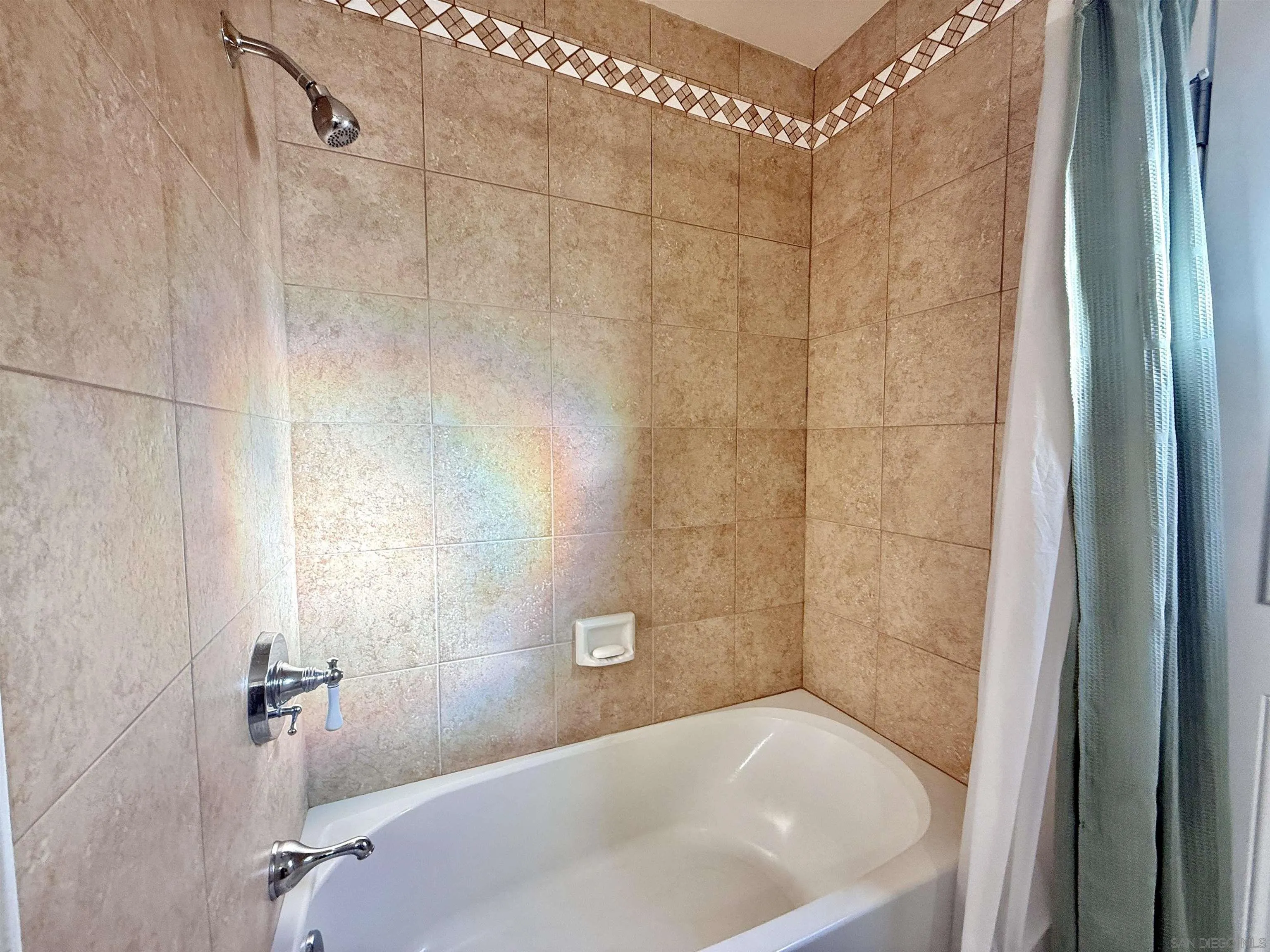 2049 Wind River Road El Cajon, CA 92019 - Photo 14 of 29 a white bath tub sitting next to a white sink and vanity