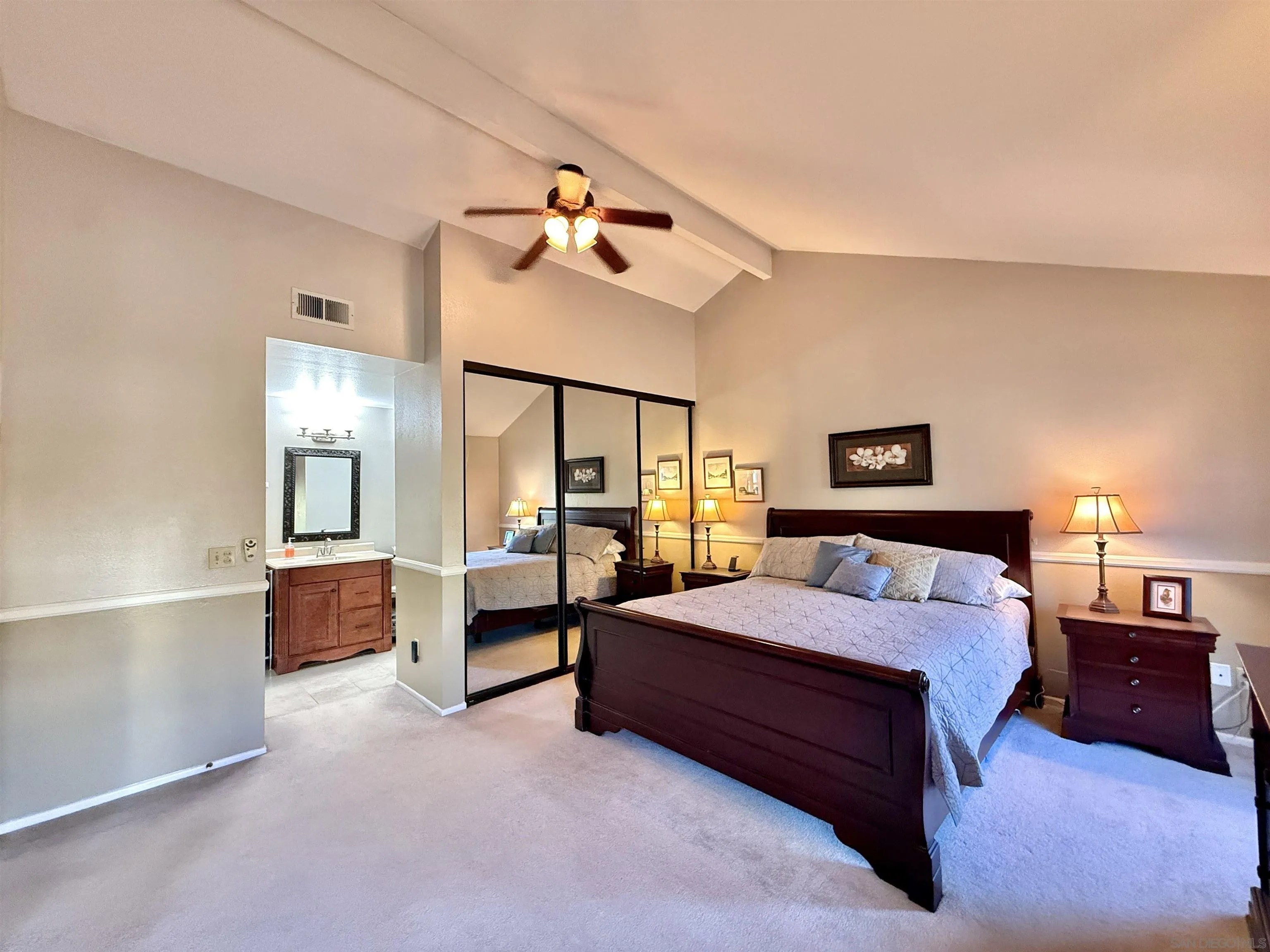 2049 Wind River Road El Cajon, CA 92019 - Photo 17 of 29 a spacious bedroom with a bed and cabinet