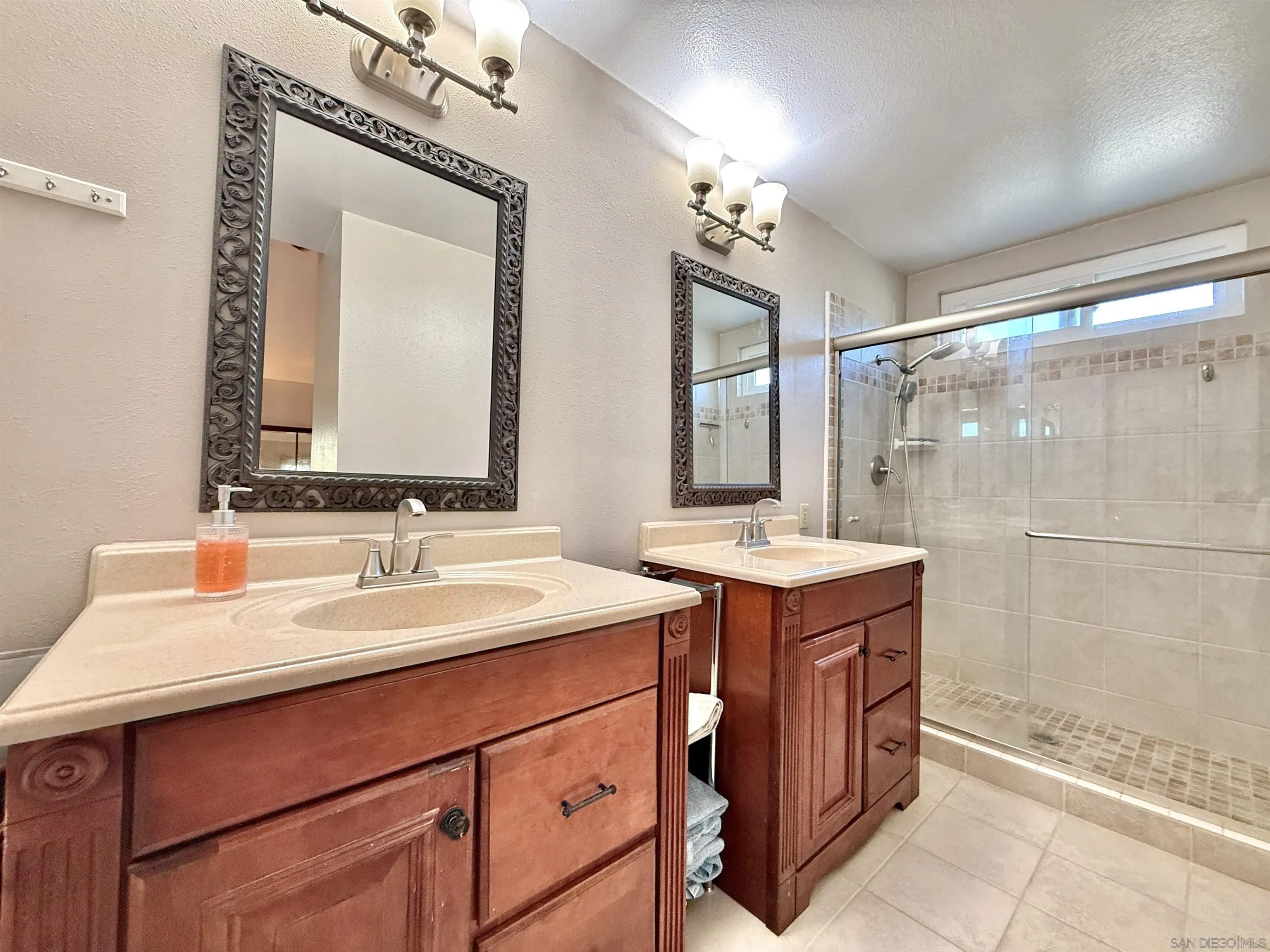 2049 Wind River Road El Cajon, CA 92019 - Photo 18 of 29 a bathroom with a double vanity sink mirror and