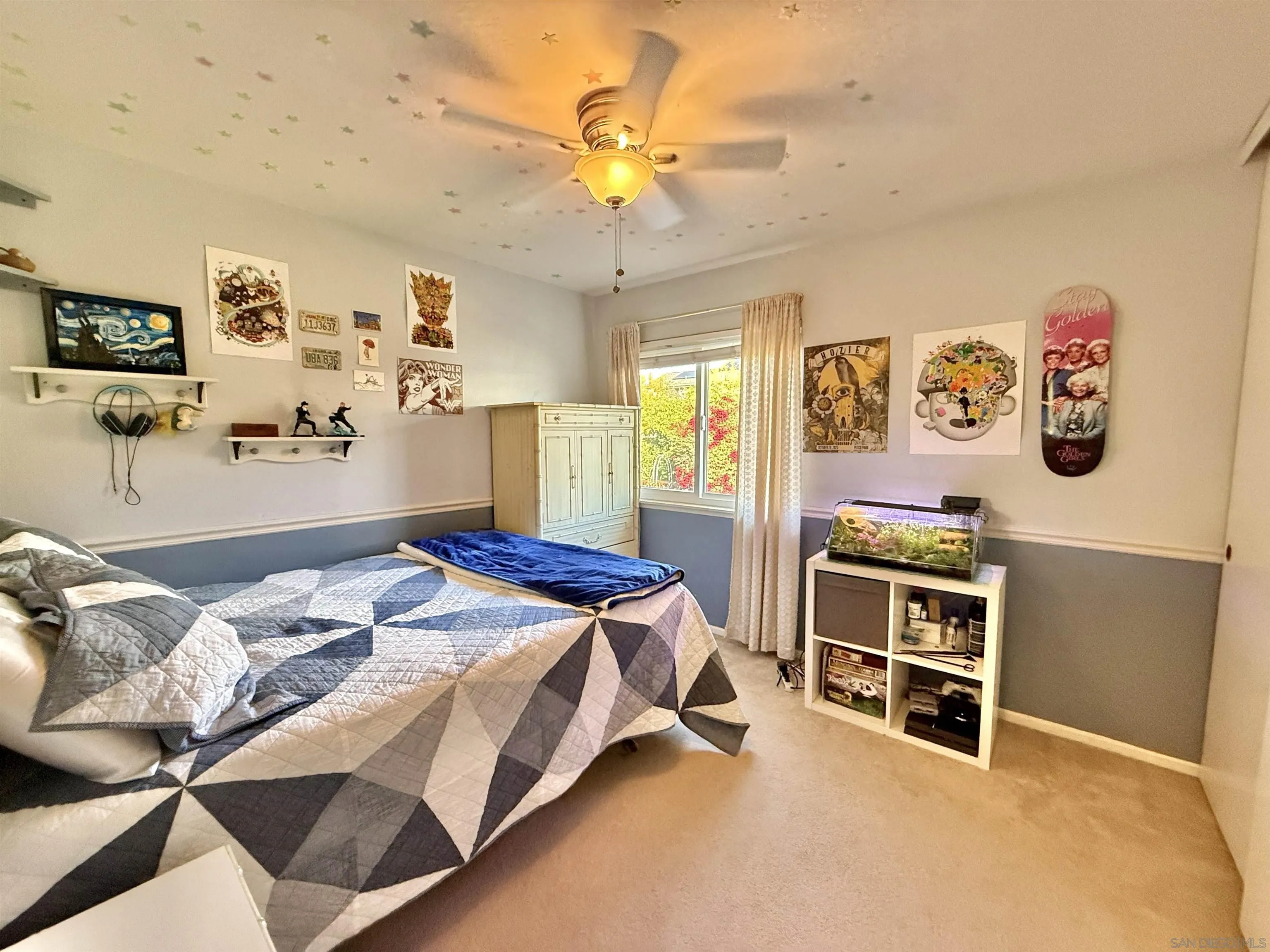 2049 Wind River Road El Cajon, CA 92019 - Photo 19 of 29 a bedroom with a bed and a chandelier