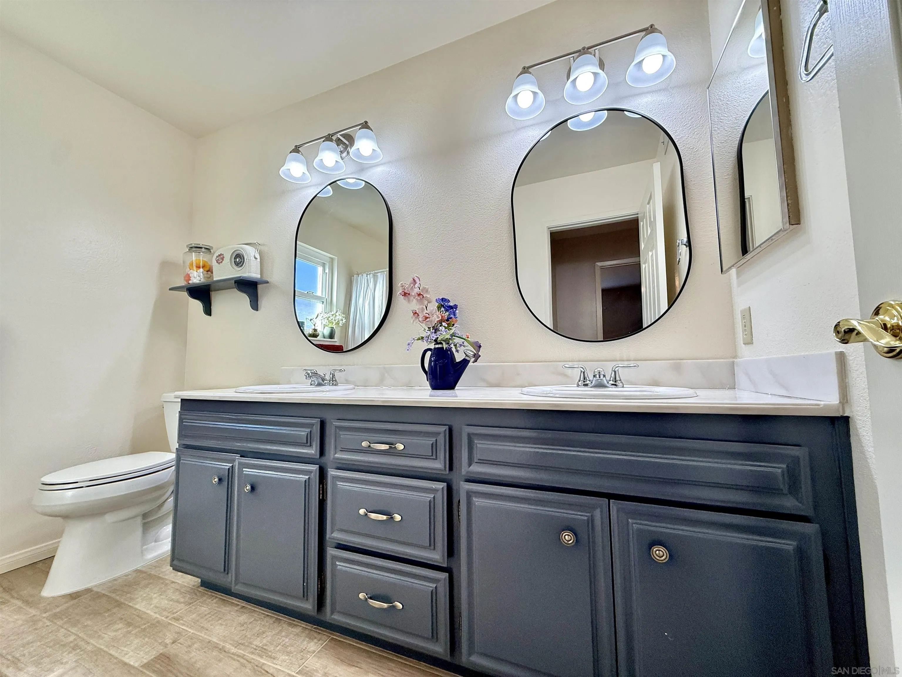 2049 Wind River Road El Cajon, CA 92019 - Photo 21 of 29 a bathroom with a double vanity sink and a mirror