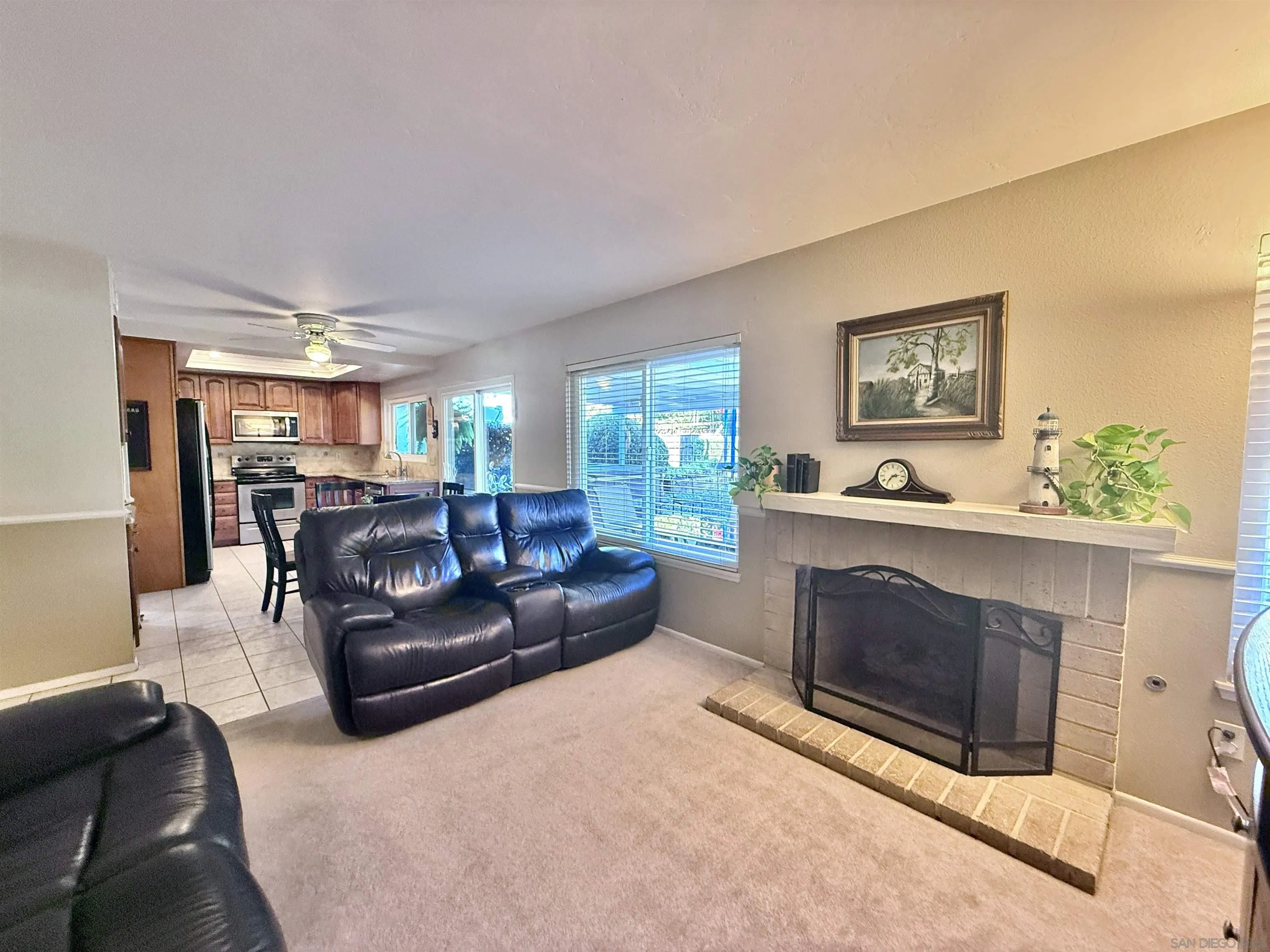 2049 Wind River Road El Cajon, CA 92019 - Photo 10 of 29 a living room with furniture and a fireplace