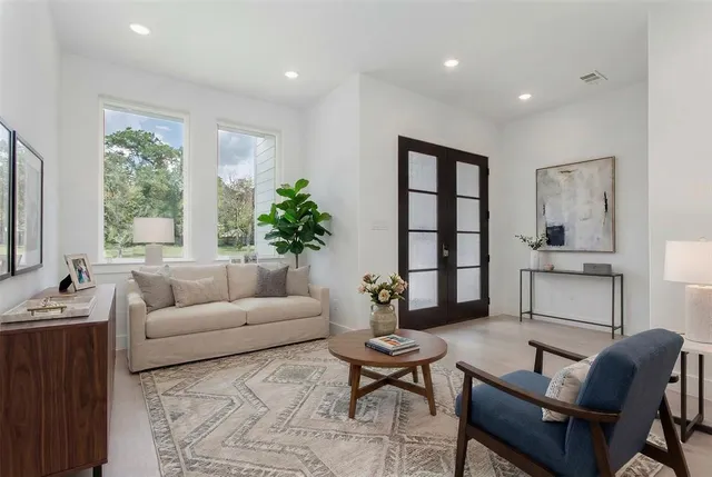 a living room with furniture and a large window