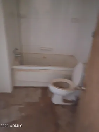 an empty room with a refrigerator