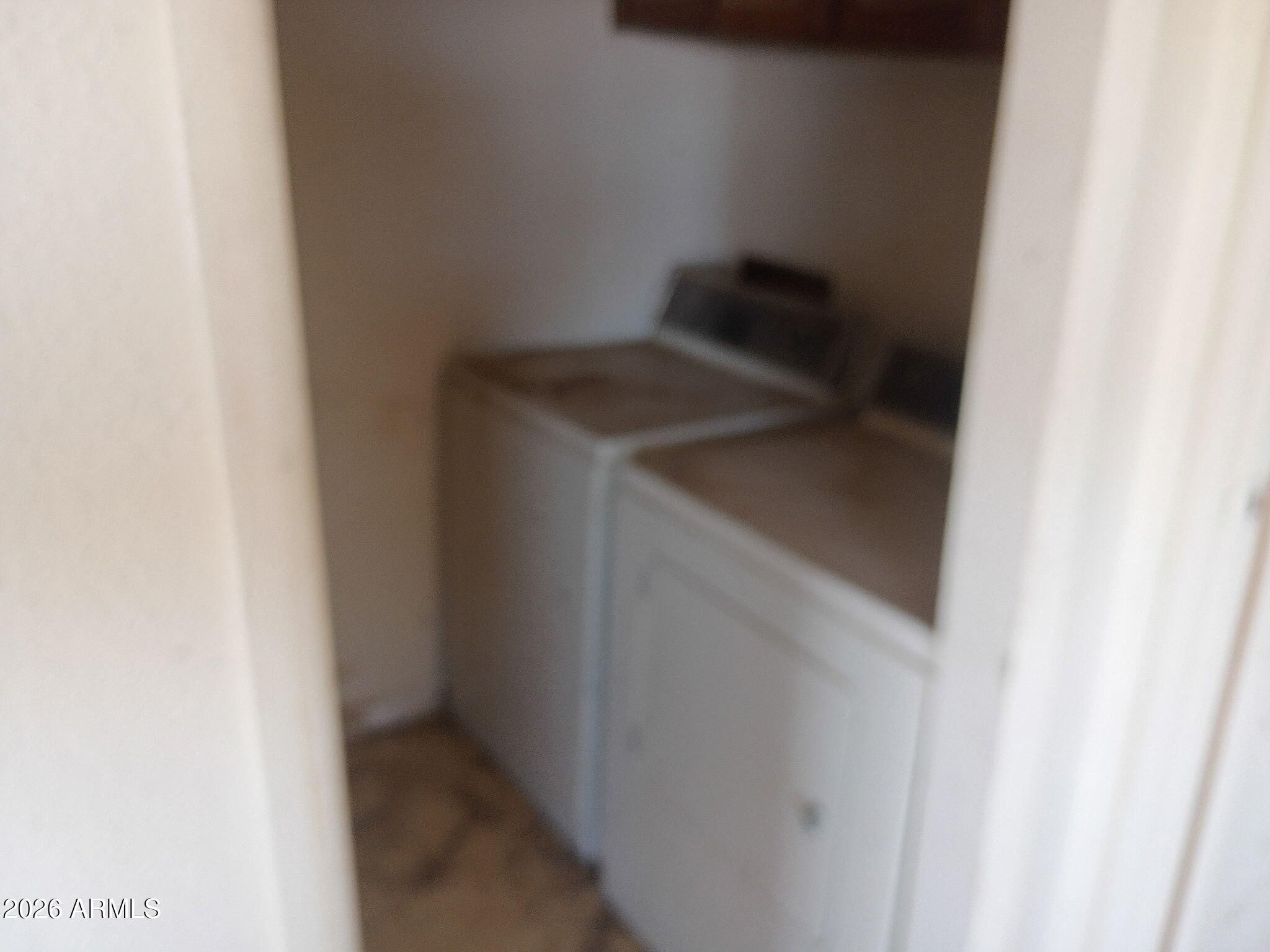 6826 North Rock House Road McNeal, AZ 85617 - Photo 13 of 13 a utility room with dryer and washer