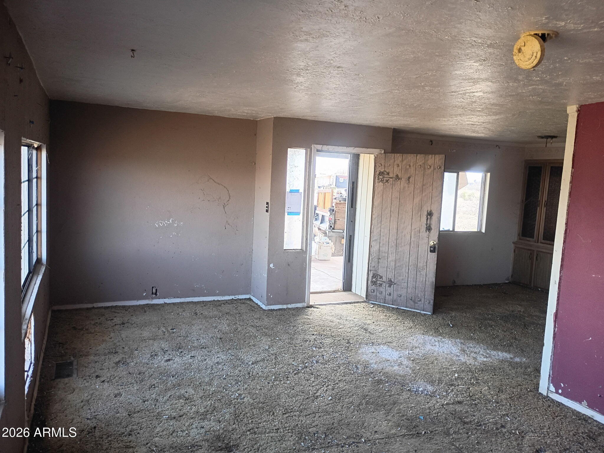 6826 North Rock House Road McNeal, AZ 85617 - Photo 8 of 13 an empty room with windows