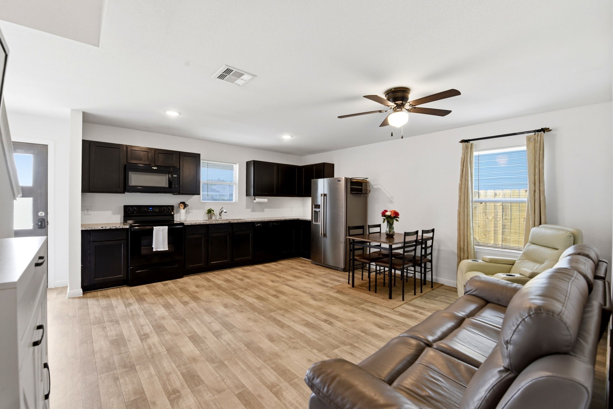 9819 Emerald Stone Way Conroe, TX 77306 - Photo 14 of 38 a living room with furniture and a flat screen tv