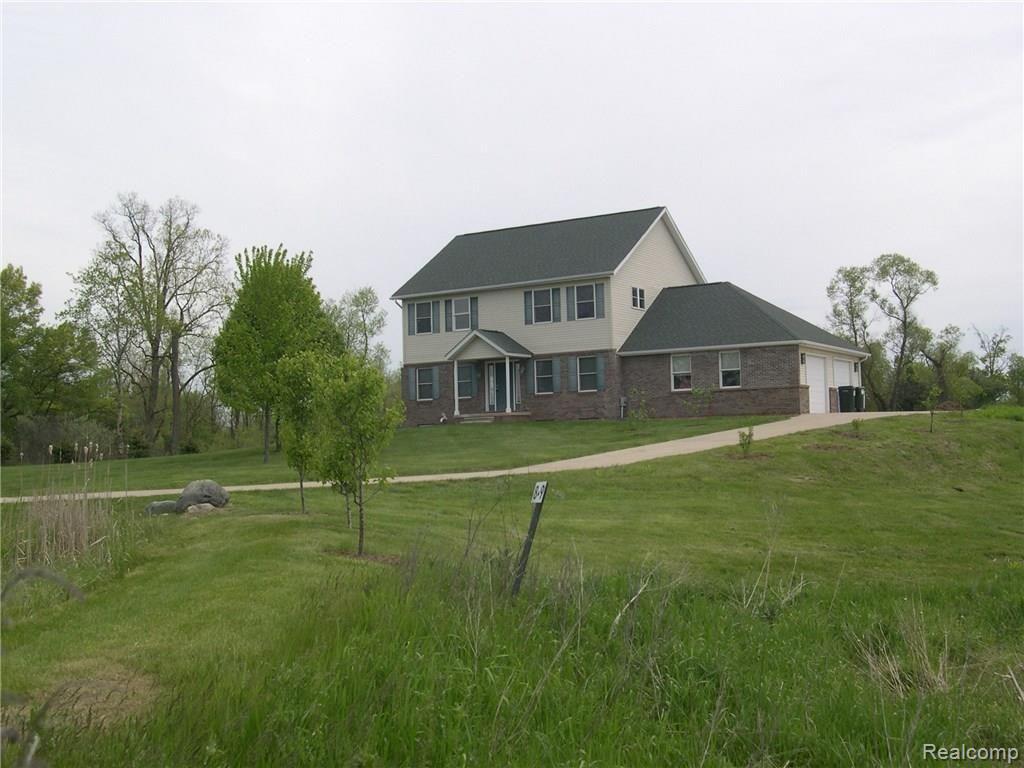 1047 Marsh Ridge Brighton, MI 48114 - Photo 1 of 25 FRONT VIEW