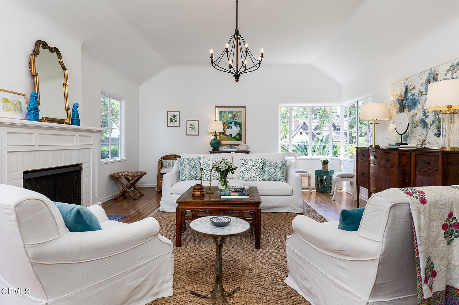 2115 Roanoke Road San Marino, CA 91108 - Photo 3 of 8 a living room with furniture a chandelier and a fireplace